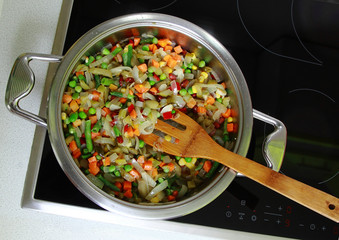 In a skillet in vegetable oil delicious fried Mexican vegetable mix.