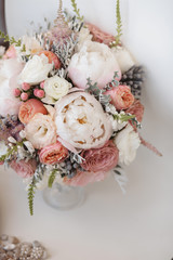 Elegant wedding flower bouqet on texture background with bridal shoes tiffany colour