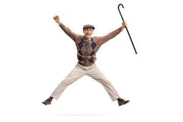 Overjoyed senior with a cane jumping