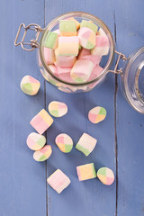 Marshmallows on wooden table. 