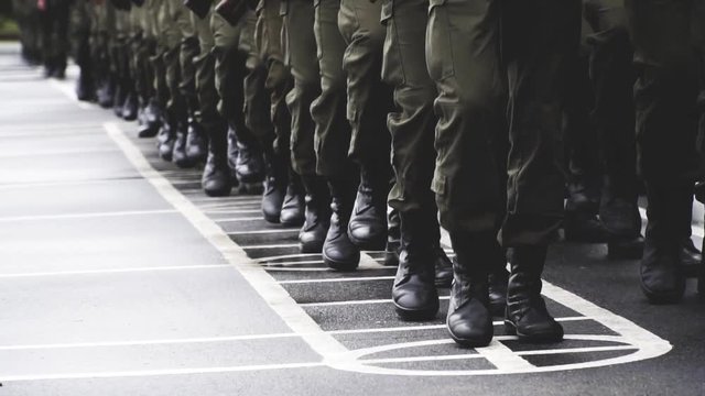 soldiers march, stand on parade ground with weapons in hands hold in hand the automatic machine on the street military oath. recruitment. National Guard. rain day