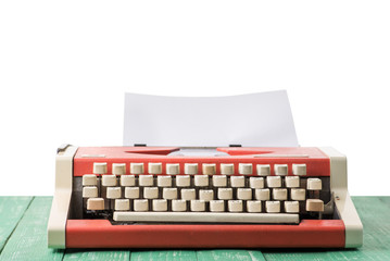 A typewriter on a table with an isolated background