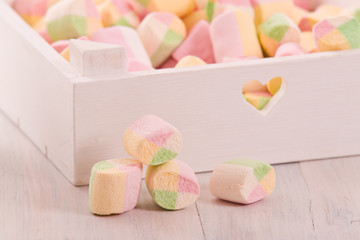 Marshmallows on wooden table. 
