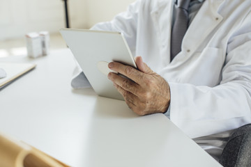 Doctor Holding Tablet