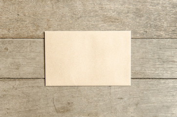 Envelope letter on wooden table.