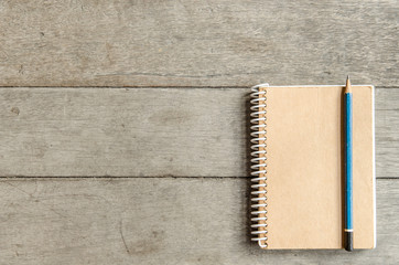 Notebook on wooden table.