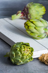 Obraz premium Green ripe raw artichokes ready to cook