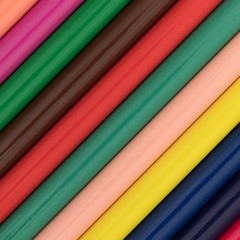 A very close view of colorful pencils at an angle.