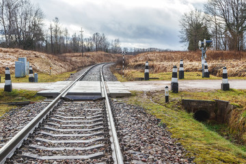 autumn day across the road to the train tracks behind the curve