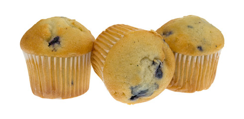 Three bite size blueberry muffins with one on its side isolated on a white background.