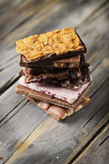 Mix of sweet swiss choccolate on the wooden table