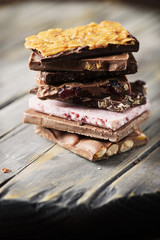 Mix of sweet swiss choccolate on the wooden table