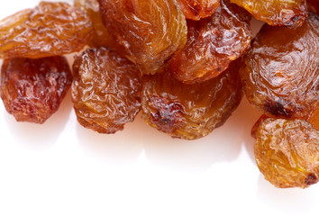 Raisins on a white background. Dried grapes.