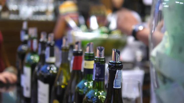 People Drinking At Bar Degustating Wine At Wine Tasting Event. Closeup. 4K.