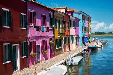 Fototapeta na wymiar Burano, Venice. Colorful houses architecture, Burano island canal and boats. Summer 2017, Italy