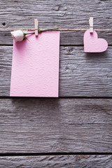 Valentine day background, card and paper heart on wood