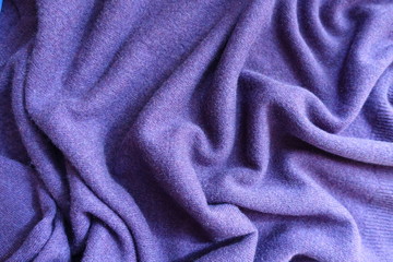Fototapeta na wymiar Draped violet thin simple woolen jersey fabric