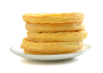 Pile of sweet waffles isolated in plate on white background