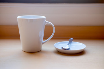 Close up white cup of hot coffee