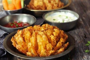 Homemade Blooming Onion with dipping sauce, selective focus