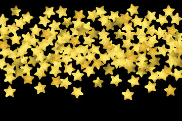 Golden confetti isolated on black background.