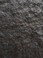 Close up rocks. Dark Stone texture. Black rock.