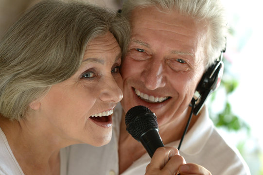 Senior Couple Singing Karaoke