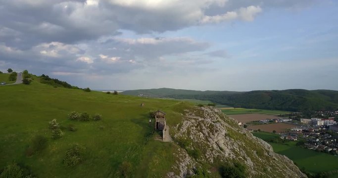 Beautiful scenery showing through a dronie from the Braunsberg hill with a view towards Hainburg and Bratislava, with the camera slowly moving away from the hill uncovering the magnificent panorama.