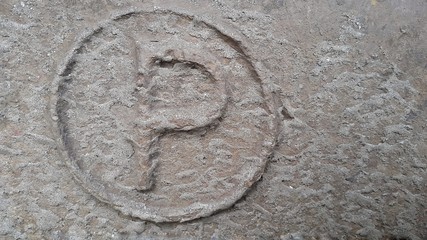 Metal latter P. Texture of rusty metal in the form of latter P.