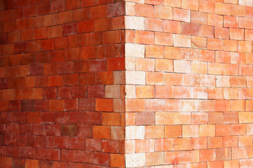 grunge brick wall background at corner of building
