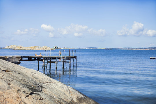 Jetty with ladders on seashore