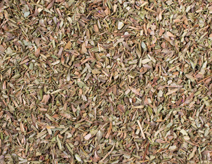 Dry chopped oregano spice. Texture background