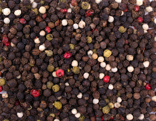 Texture background. Mix of different Colorful dried  peppers balls seeds Top view