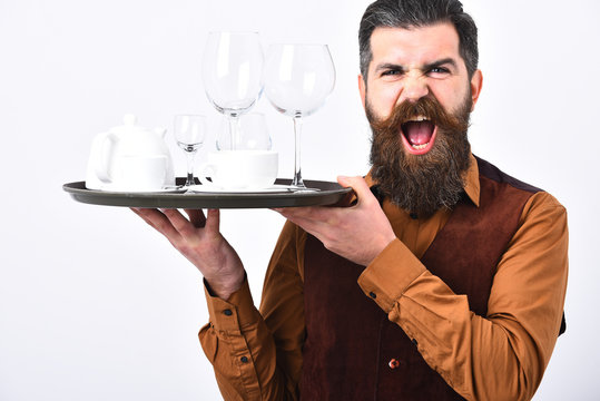 Barman with mad face serves tea or alcohol drinks.
