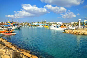 Fototapeta na wymiar Fishing boats and yachts in harbor of Ayia Napa, Cyprus.