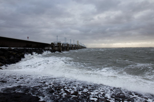 Storm surge barrier Eastern Scheldt dam closed for high sea level in storm