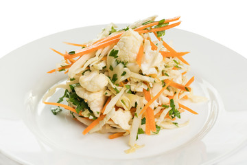 salad of white and cauliflower with carrots on a white plate
