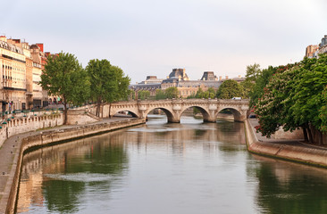 Fototapeta na wymiar View of Pont Neuf and Seine embankment at spring morning in Paris, France.