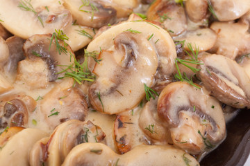 Close up of cooked mushrooms in butter.
