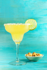 Margarita cocktail photo on vibrant background with copyspace