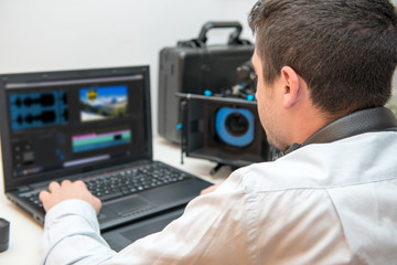 Fototapeta na wymiar young man designer using graphics tablet for video editing