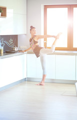 Fitness girl cooking healthy food in the kitchen. Woman. Kitchen. Cooking