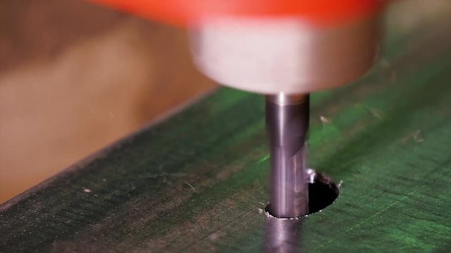 Bending flat metal then make a hole at flat bar by drilling machine. lose up tool of automatic drilling machine make hole at metal with cooling by coolant water and evaporate to steam