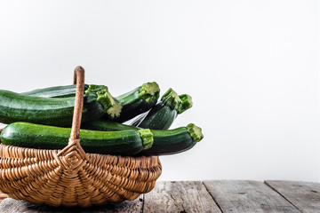 Fresh zucchini, green vegetables on farmer market, eco produce freshly harvested from the garden