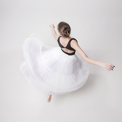 The top view of the teen ballerina on white background