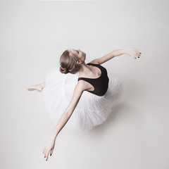The top view of the teen ballerina on white background