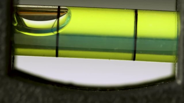 Level tube close up. Macro of bubble in level tool. Level tool. Close up macro level measurement.