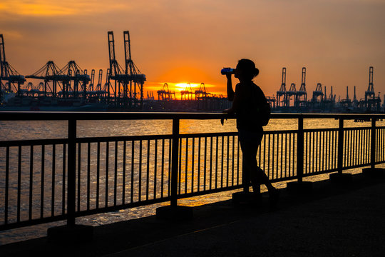 Silhouette of woman drinking at Labrador Park