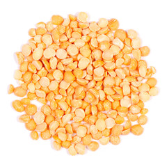 A pile of peas a wooden spoon on a white background