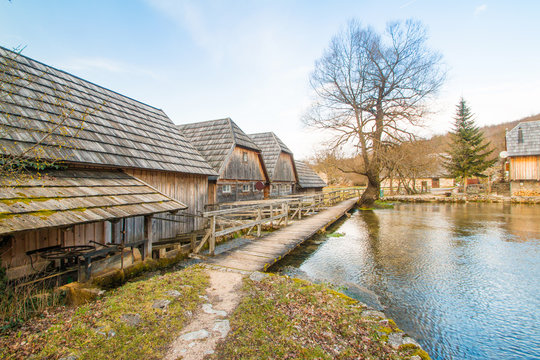      Old wooden water mills on Majerovo vrilo, countryside landscape in Lika, Croatia 
